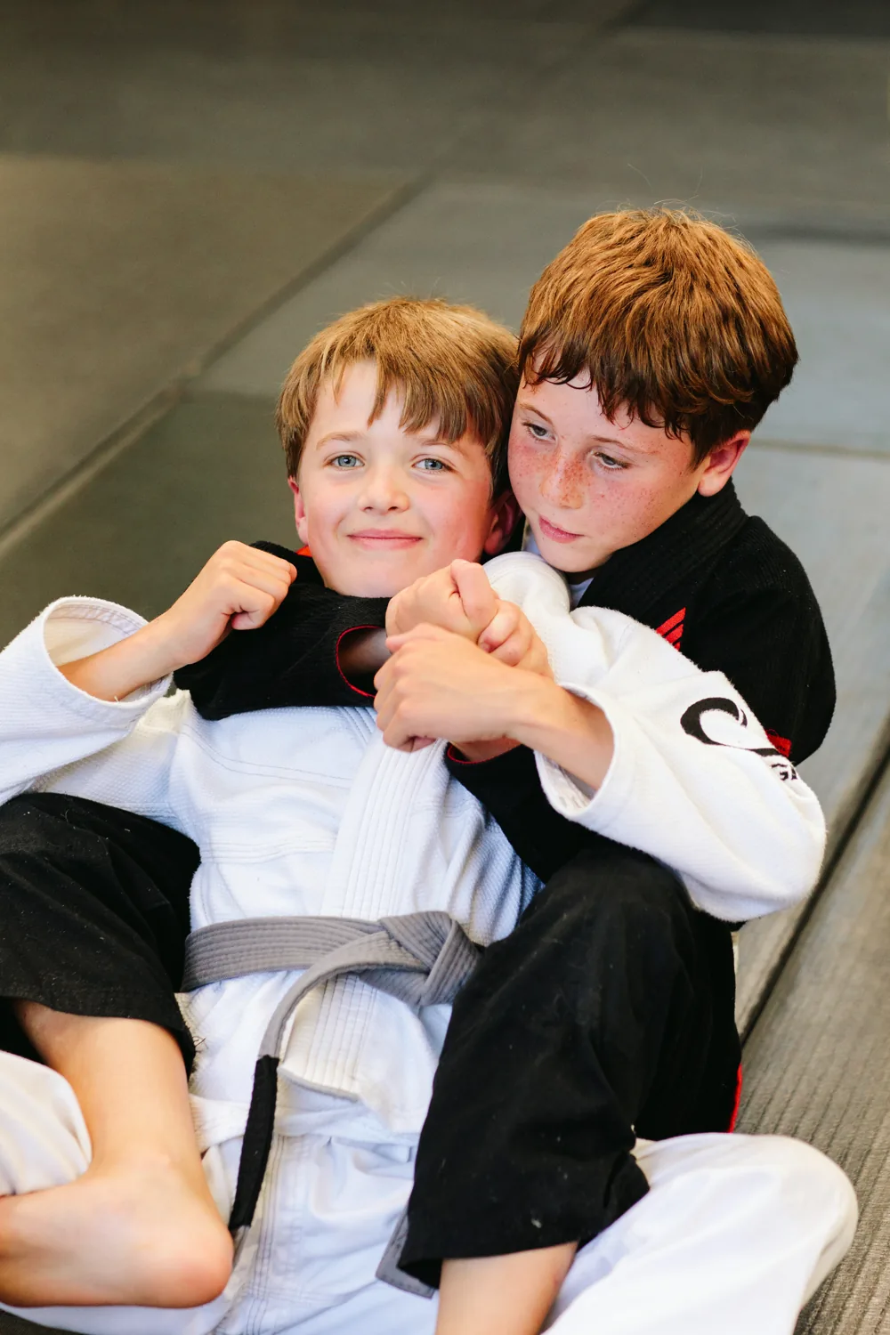 Two kids after Jiu Jitsu class at Flow BJJ