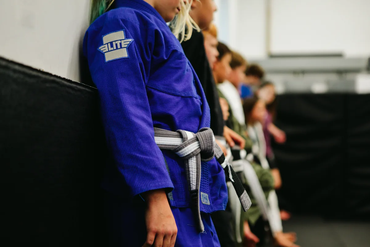 Flow BJJ kids class lined up on the mats